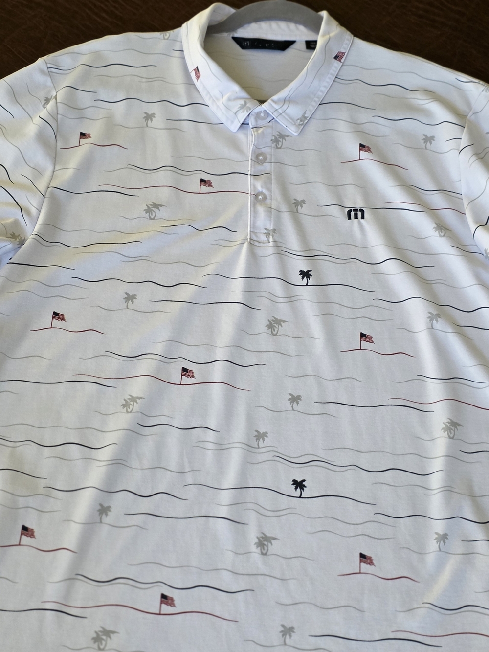 TravisMathew White Polo with Nautical Wave, Flag & Palm Motif
